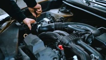 ASE-certified technician running engine diagnostics on a customer car at Allied Auto Services in Roselle